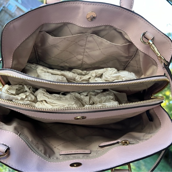 Cute Michael Kors pink bag. Holds a lot of stuff. Has three compartments. - Picture 7 of 7